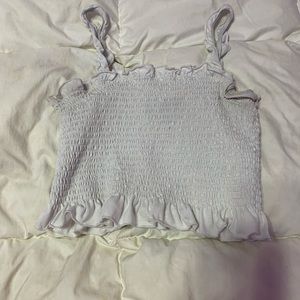 White tube top. slight discolored on the sleeves and under the arms. gently used